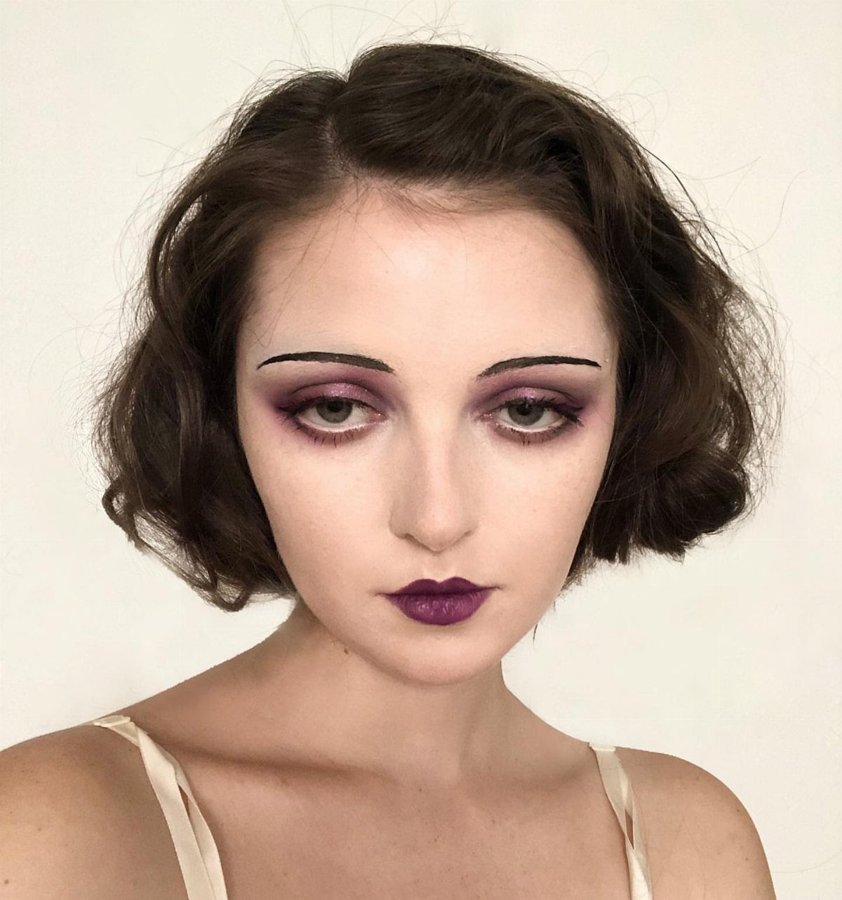 1920s Women Makeup: 9 Ideas for Lips, Eyes and Nails 8 Woman with 1920s style makeup featuring dark purple lips and dramatic eyeshadow