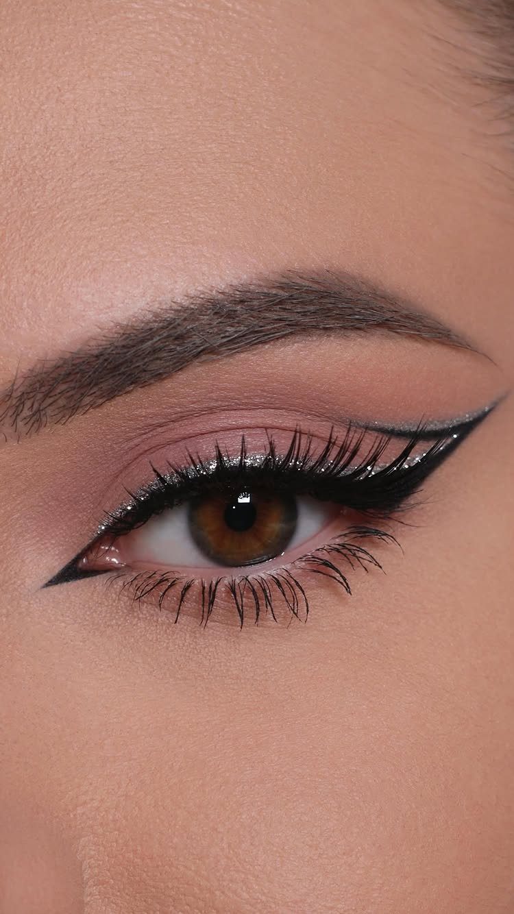 2006 Makeup Look Ideas: 6 Styles From Frosted Shadow to Glitter 6 Close-up of an eye with sharp winged eyeliner and pink eyeshadow.