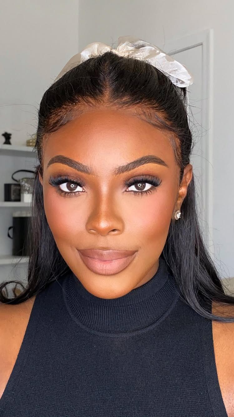 Woman with a flawless soft matte base and full glam baddie makeup look.