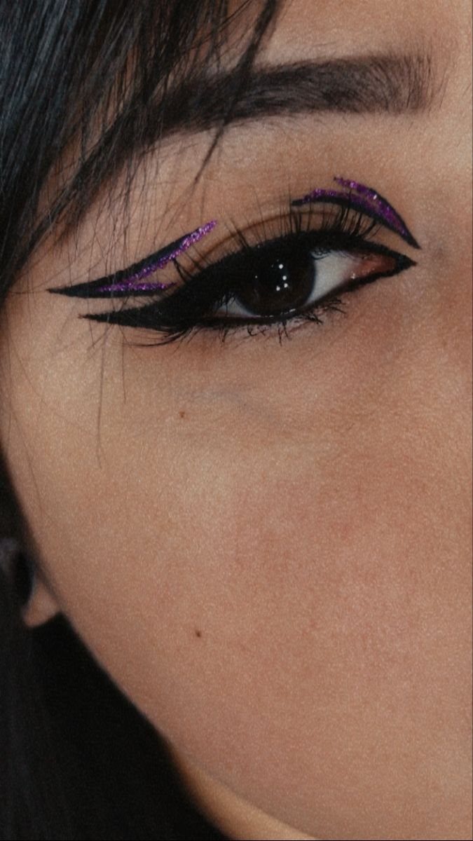 Black Purple Makeup Ideas: 5 Looks for Eyes and Lips 4 Eye with black winged eyeliner and purple glitter accents on the upper lid