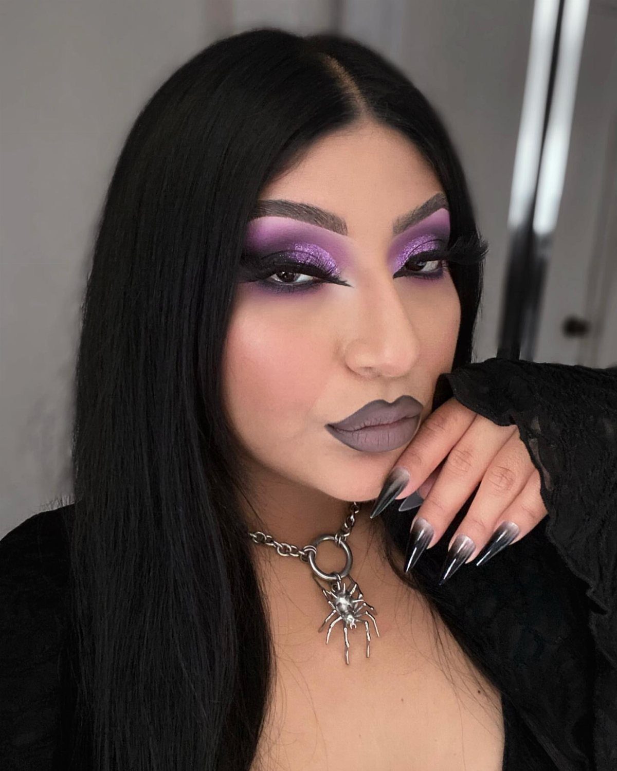 Black Purple Makeup Ideas: 5 Looks for Eyes and Lips 3 Woman with purple and black blended eyeshadow, purple lips, and spider choker.