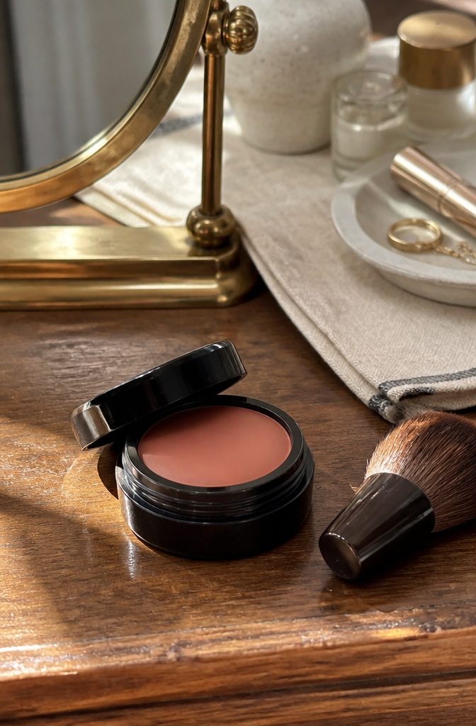 Bobbi Brown Pot Rouge Velvet Matte Blush in a wooden vanity.
