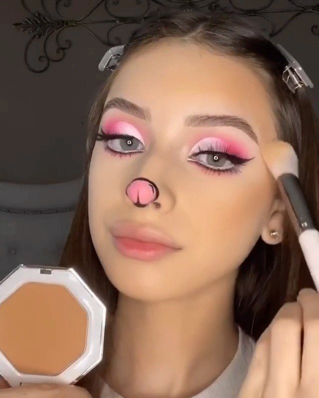Bunny Face Makeup: 8 Ideas for Whiskers, Blush and More 5 Woman with bunny makeup showing black winged eyeliner and pink eyeshadow