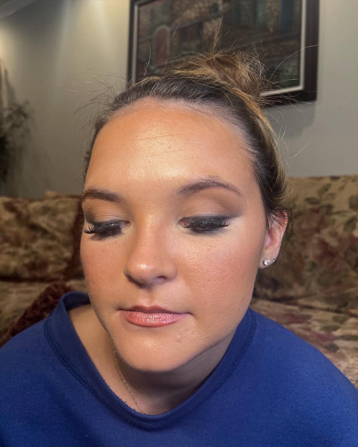 Daily Smokey Eye Ideas: 9 Looks for Every Day 7 Woman with a dark smokey eye makeup look wearing a blue sweater.