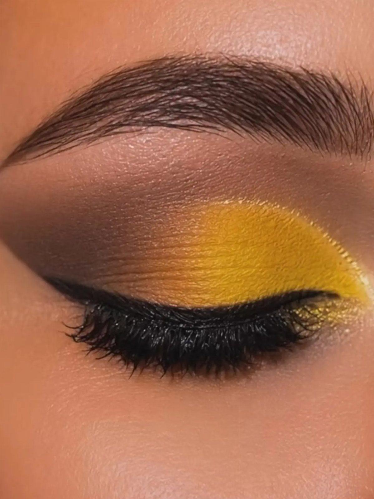 Eye Makeup for Sunken Eyes: 5 Ideas That Add Volume 2 Eye with yellow eyeshadow on the lid and brown shade in the crease.