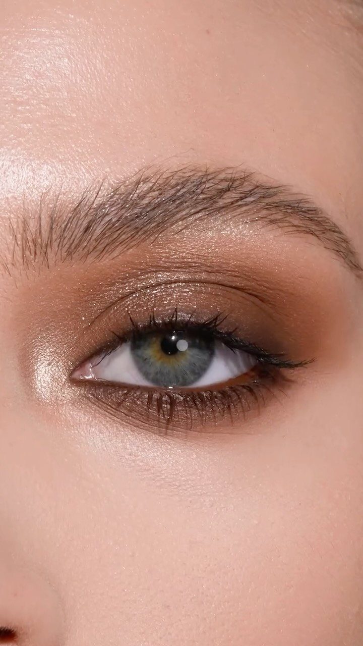 Close-up of an eye with bronze eyeshadow and dark smoky eyeliner.