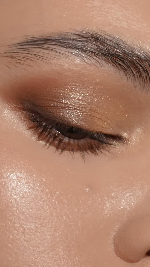 Makeup for Eye Bags: 3 Ideas for a Smoother Look 2 Close-up of an eye with gold eyeshadow and concealed under-eye bags.