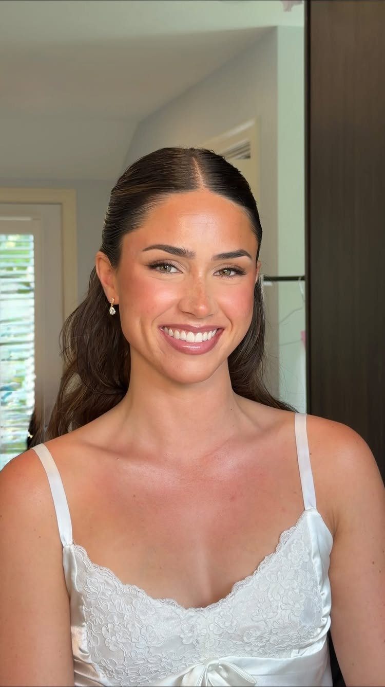 Natural Bronzy Makeup Looks: 10 Warm Glow Ideas 4 Smiling woman with warm bronzy makeup wearing a white lace satin camisole.