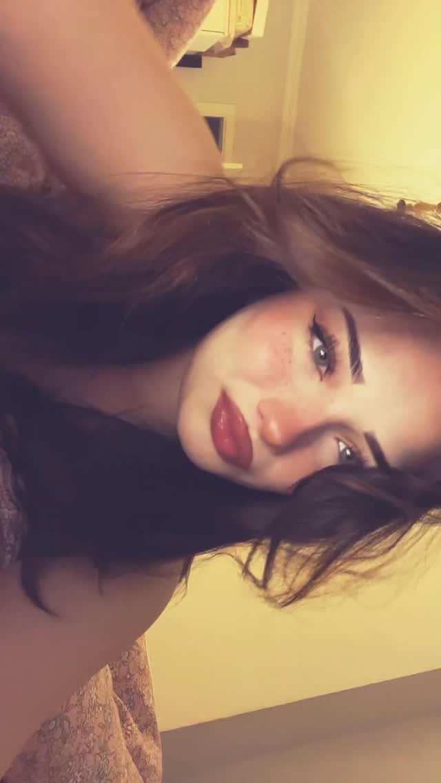 Soft Sultry Makeup Ideas: 10 Looks for Day and Night 10 Woman with long brown hair wearing soft sultry makeup and matte red lipstick.