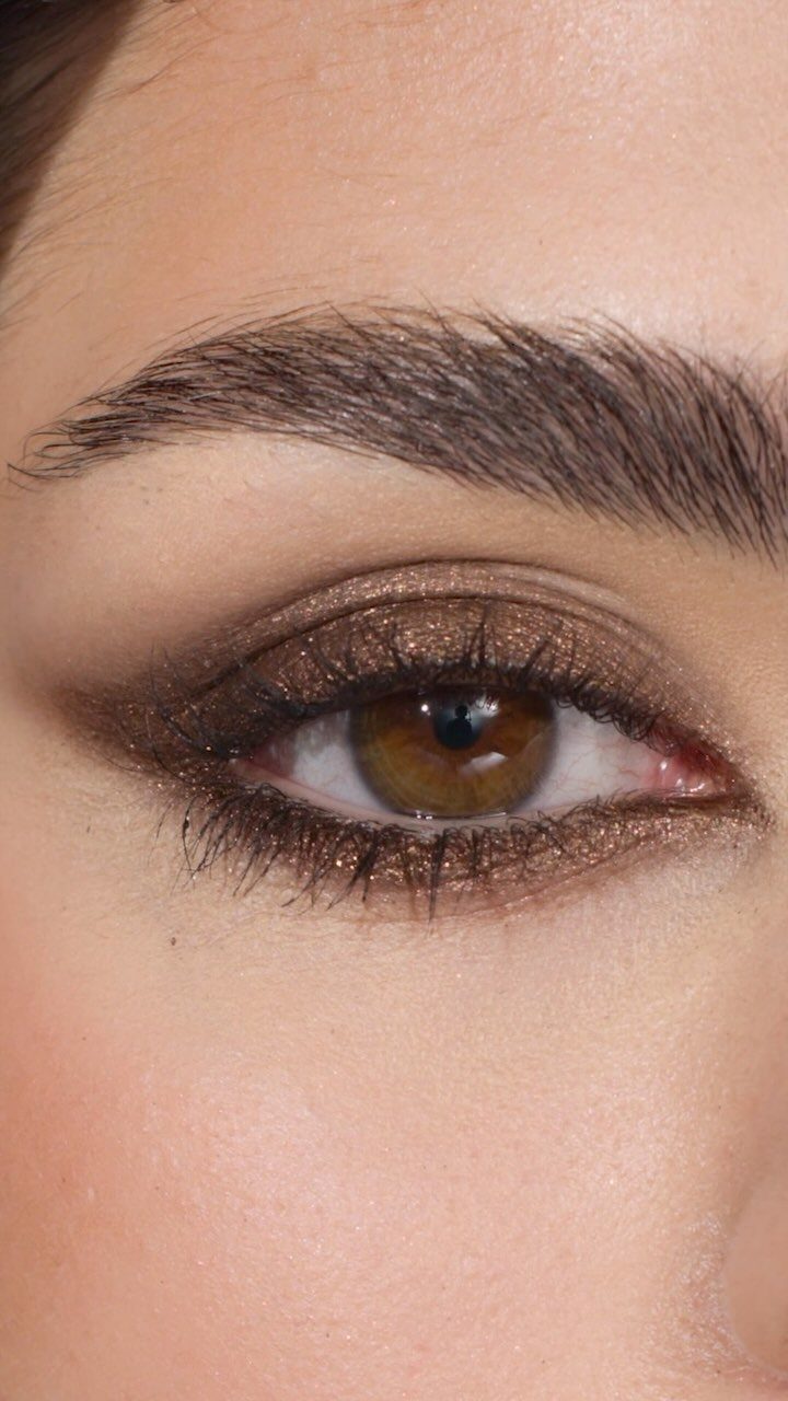 Soft Sultry Makeup Ideas: 10 Looks for Day and Night 2 Close-up of an eye with shimmering bronze eyeshadow and dark soft eyeliner.