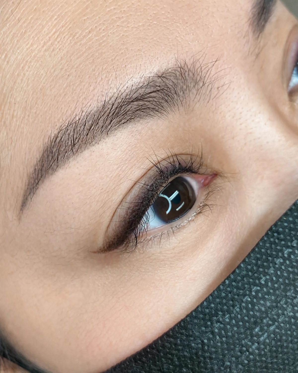 Soft Sultry Makeup Ideas: 10 Looks for Day and Night 3 Close-up of an eye with soft, blended dark eyeliner and groomed eyebrows.