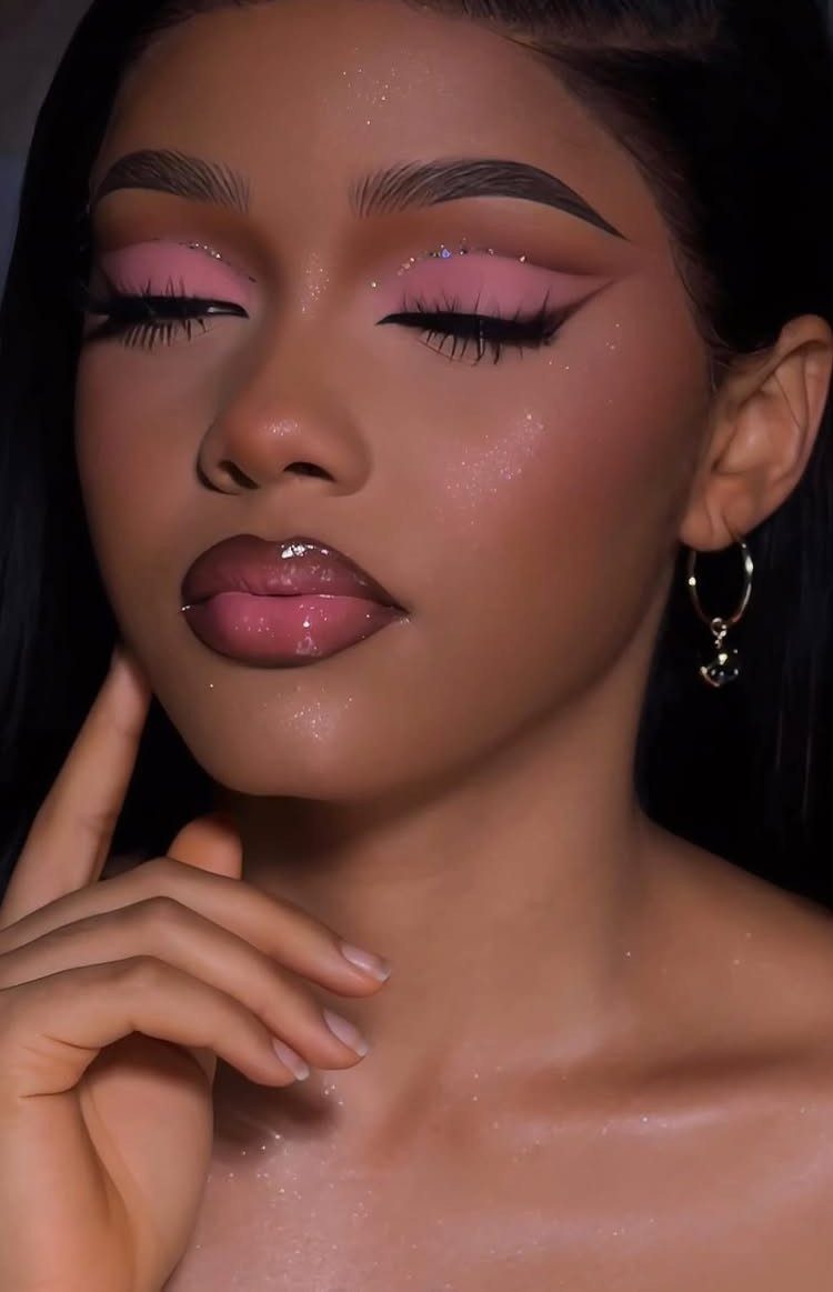 Soft Sultry Makeup Ideas: 10 Looks for Day and Night 9 Woman with pink eyeshadow and glossy lips posing for a beauty portrait.